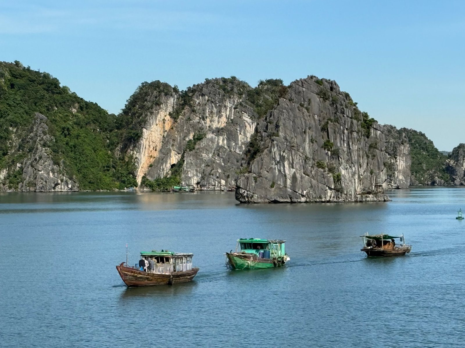 Fishing boats among limestone islands, on the founder's trip to Vietnam
